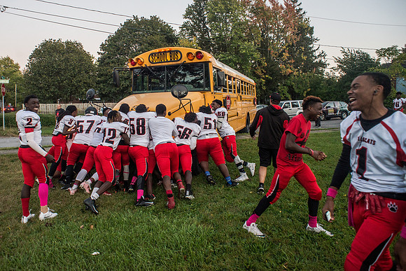 School bus carrying Wilson HS JV football team stuck on sidewalk