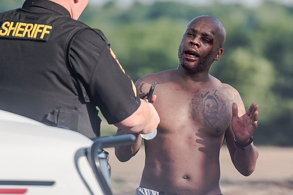 An act of humanity at the end of a long, hot and humid manhunt